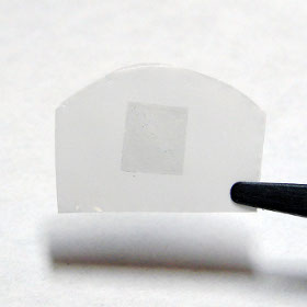 The graphene membrane used by Prof. Karnik and his team. The membrane is 5mm square, on a polycarbonate substrate.