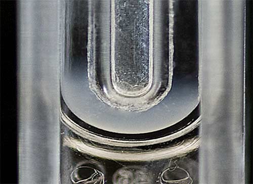 Photograph showing a liposome aliquot injected into the measurement zone of a folded capillary cell containing PBS.