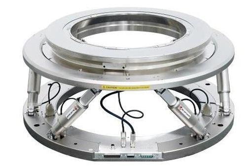 “6+1 Axis” precision motion system: Low profile PIMag® torque motor rotation stage adds 360° rotation capability to large aperture 6-DOF hexapod multi-axis positioning system.