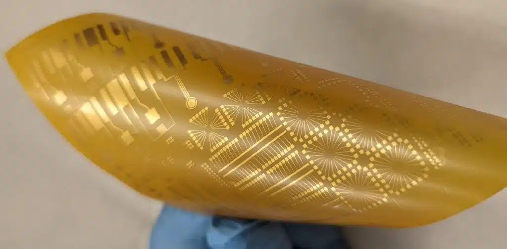 Gold thin film electrodes on flexible polyimide sheet.