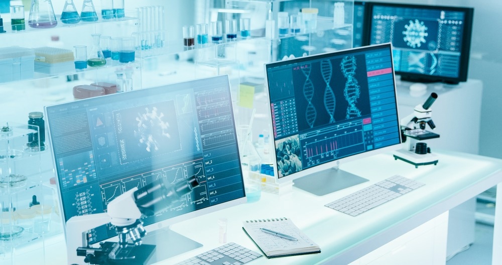 Futuristic laboratory equipment - coronavirus testing. Computer screens in laboratory. DNA models and coronavirus research