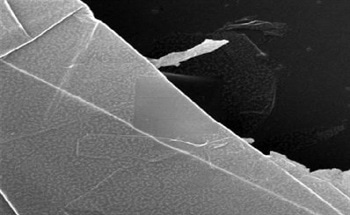 Imaging and Nano-Machining of Graphene Using a Helium Ion Microscope