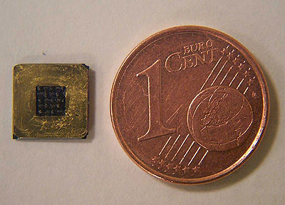 Top view of a miniature fuel cell, scale comparison with a 1 cent (0,01 euro) coin.